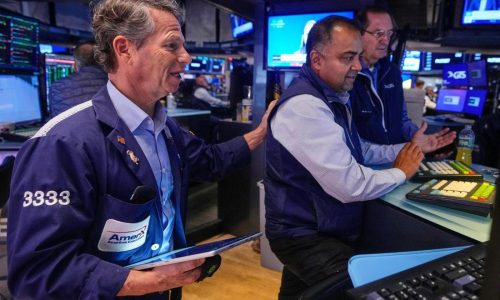 Wall Street rises and pulls close to its record