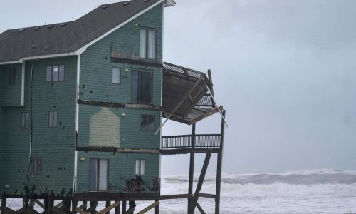 Dozens rescued as remnants of typhoon hits Alaska while nor’easter brings flooding to East Coast