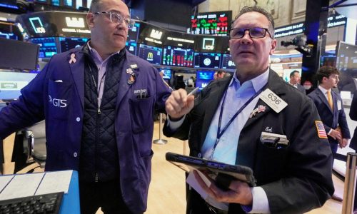 US stocks slip in morning trading as more companies report their results