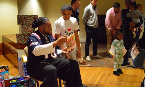 Patriots player visits Heading Home shelter at Lowell ICC to hand out toys to kids