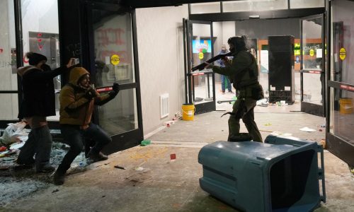 Anti-ICE protesters clash with federal agents at Minneapolis hotel