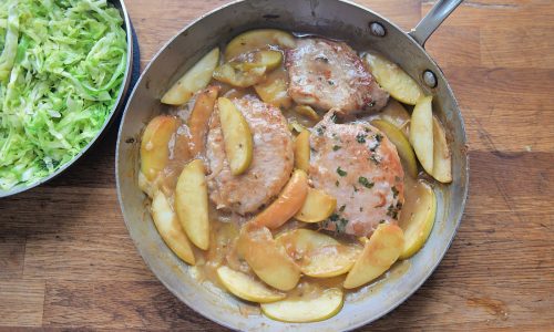 One-pot recipe brings together pork chops, apples and warm cabbage slaw